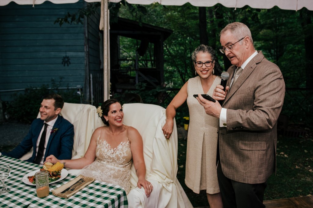 candid wedding photographer photos of a wedding reception speeches