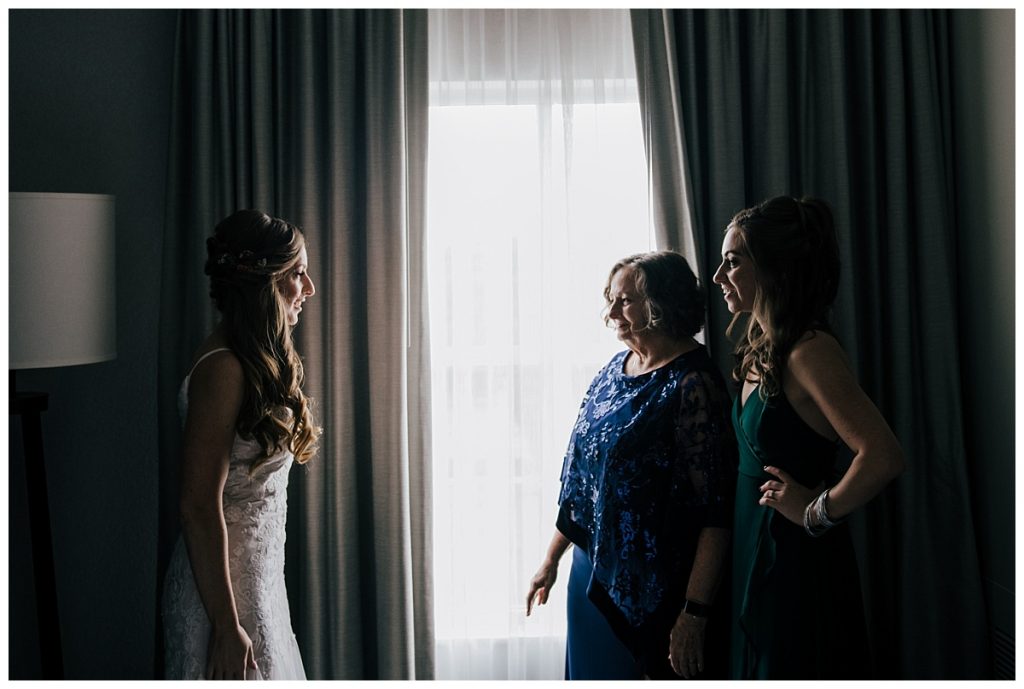 A Saratoga Springs SPAC Wedding 7 bride, her mother maid of honor getting ready in gorgeous light
