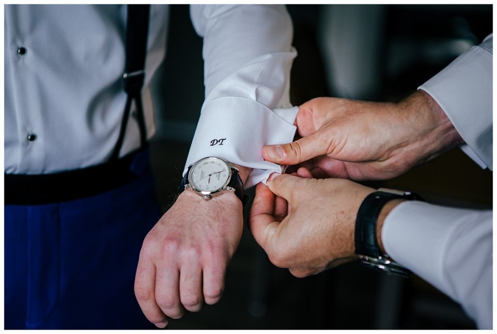 A Saratoga Springs SPAC Wedding 17 groom getting his cufflinks on