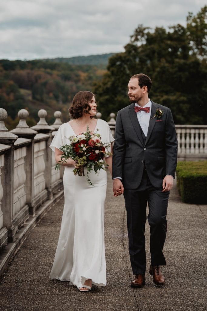 bride and groom walking on their wedding day at a fall wedding at the CIA