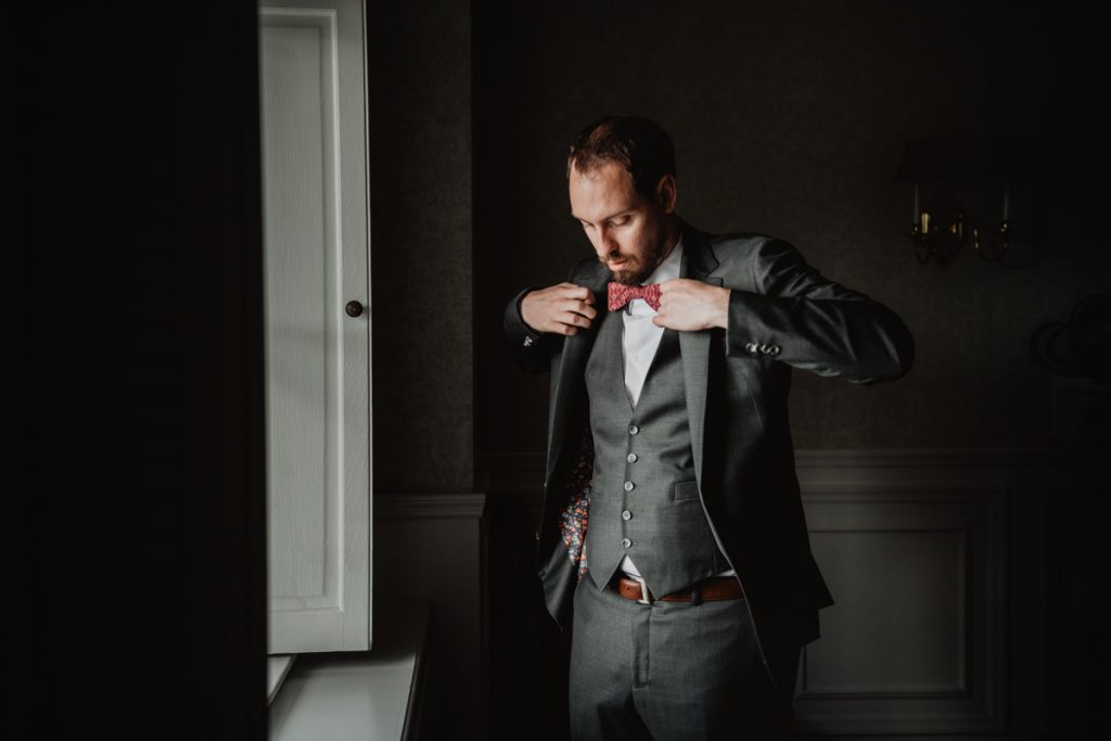 a groom getting ready at a Culinary Institute of America (CIA) Hyde Park wedding