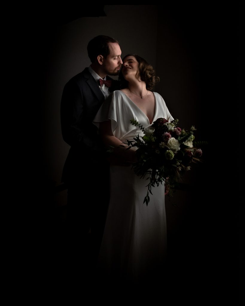 Dark and Moody photo of a bride and groom atCulinary Institute of America (CIA) Hyde Park wedding