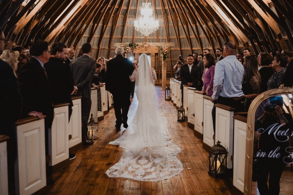 bride walking down the aisle The Stone Barn at Beardslee Farm Wedding cermony