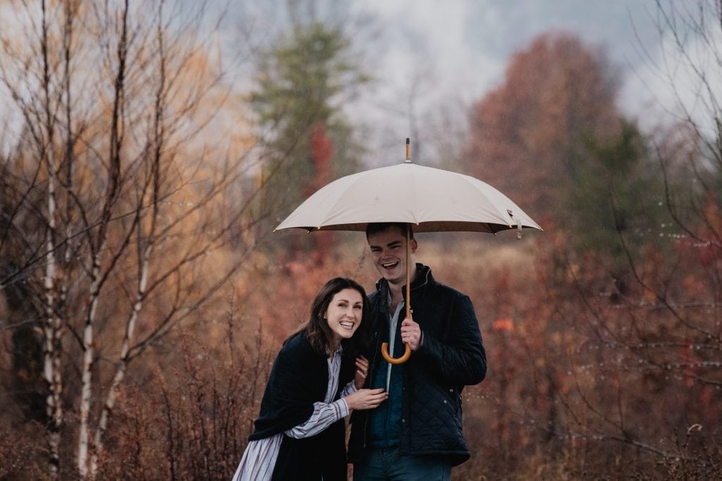 Wildflower Farms Proposal: A Dreamy Rainy Day Engagement at Wildflower Farms Auberge 23 couple laughing after surprise proposal at Wildflower Farms Catskills